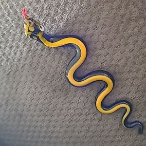 Blue glass snake with orange stripe